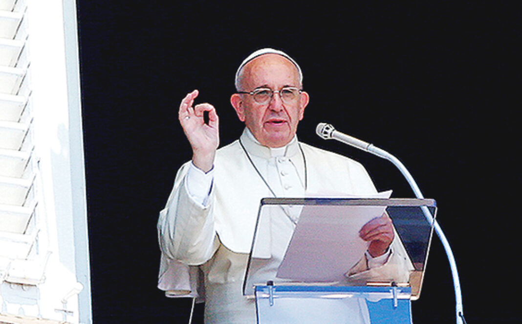 Pope Francis gestures during his Sunday Angelus prayer in Saint Peter's square at the Vatican